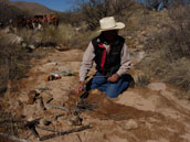 mike carefully prepares a fire for lunch